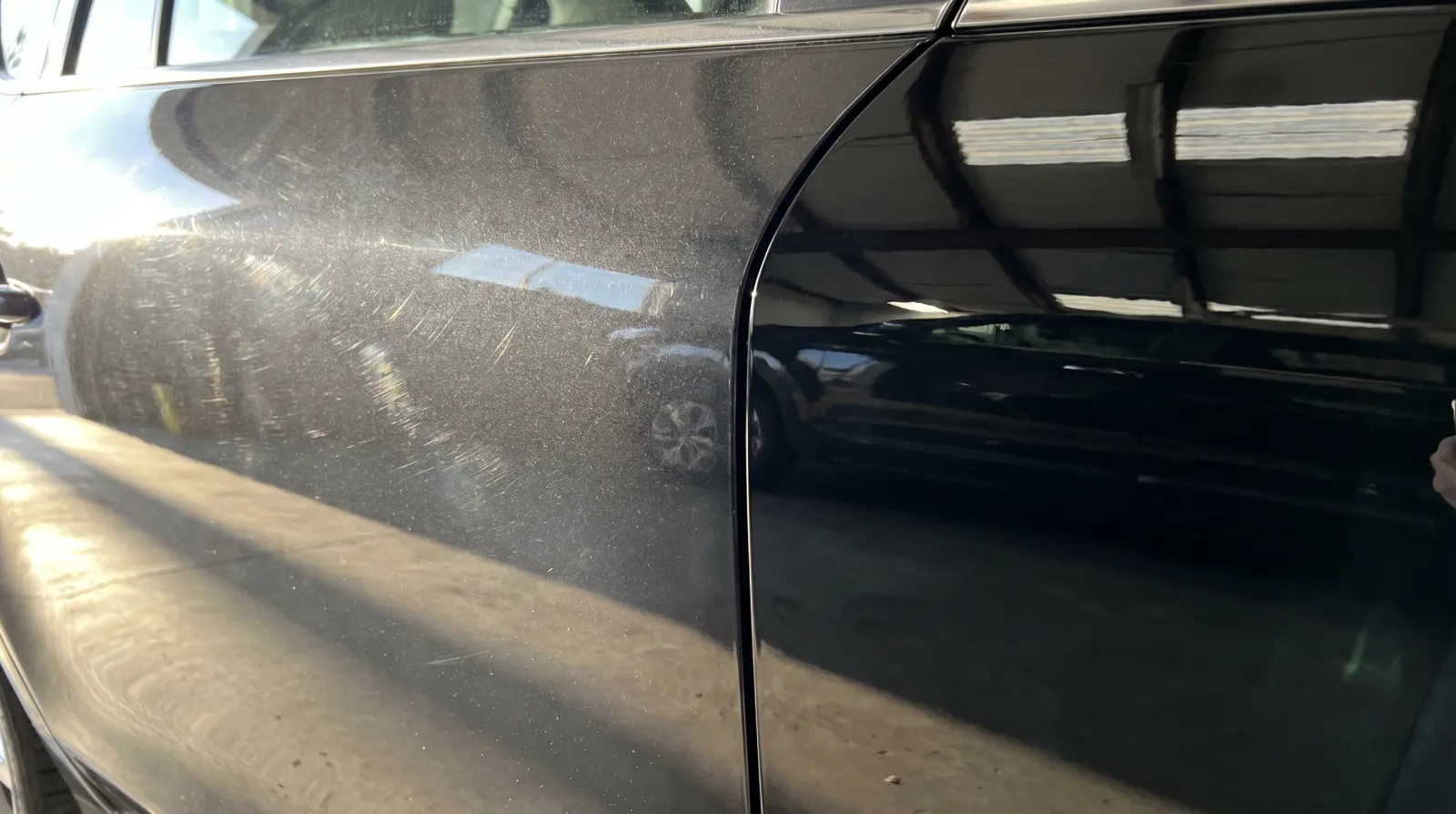 Raking light comparison showing swirl marks on uncoated paint versus a clean mirror reflection on coated paint
