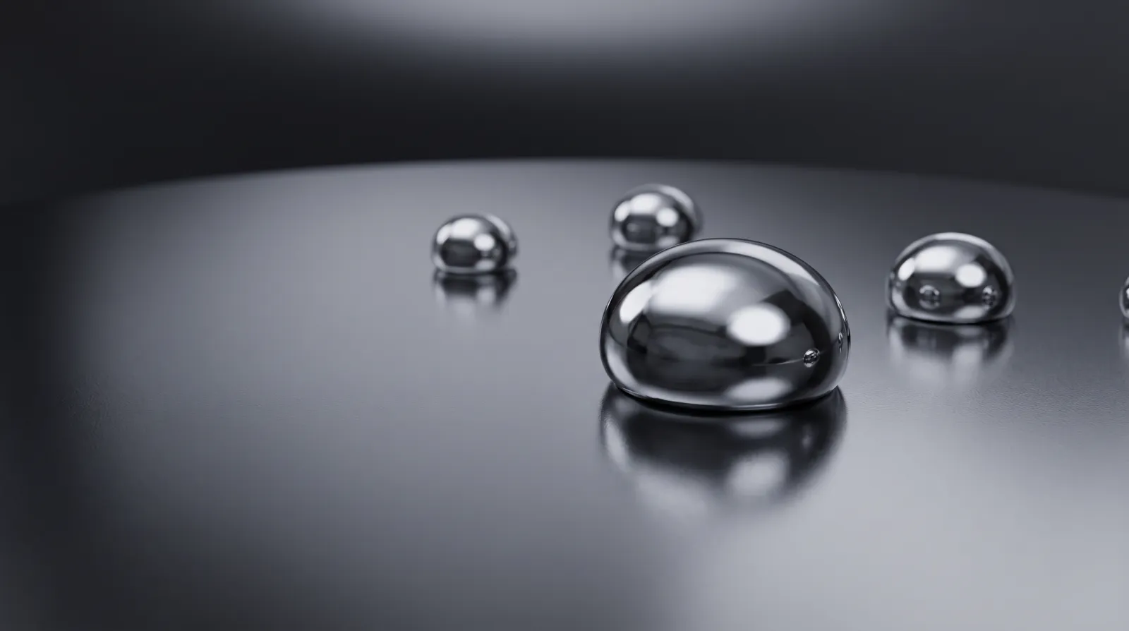 Macro of mercury-like water beads on a graphene-coated dark metallic panel