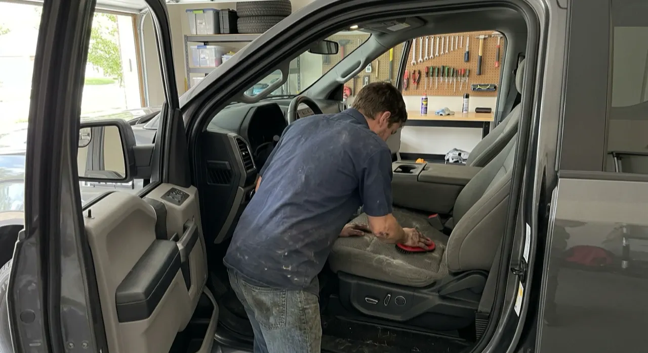 How to Remove Pet Hair From Car Seats (That Works) — a spotless detailed car interior, clean dashboard, seats and console